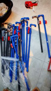 Blue and black plastic pipe fittings for overhead aquarium pipes. Multiple lengths and angles. Red valve attachments.