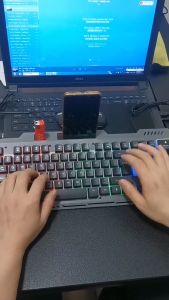 Metal Gaming Keyboard Mechanical Feel Wired Keyboard with Backlight Luminous Gaming Keyboard with Phone Holder Design