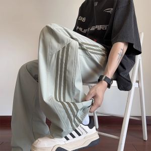 New 2024 Mens Summer Ice Silk Drape Pants Loose Wide Leg Side Stripe American Style Casual Trousers Fashionable Three Bars