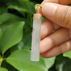 Good Translucent Icy Natural Type-A Jadeite-Jade crafted with shape of cylindrical set with 18k gold clasp as Pendant certificate weighs 6.96 grams measurement 43.8 * 8.1 * 7.1 mm (18kp64)