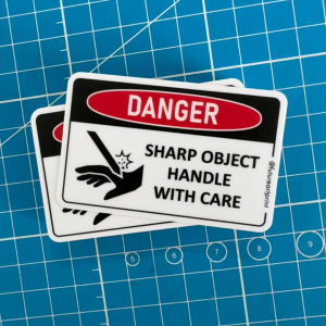 Danger Sharp Object Handle With Card. Cut Hand Finger Risk Injury Hazard Machine. Sticker Warning Caution Label Sign