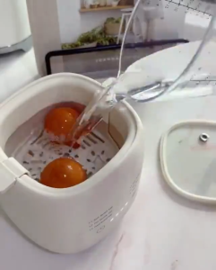 เครื่องต้มไข่ไฟฟ้า  เครื่องนึ่งไข่อัตโนมัติมัลติฟังก์ชั่น Smart Timer เครื่องต้มไข่ไฟฟ้า มี 6 โหมด ปิดอัตโนมัติ ใช้งานง่าย ขนาดกะทัดรัดพกพาสะดวก