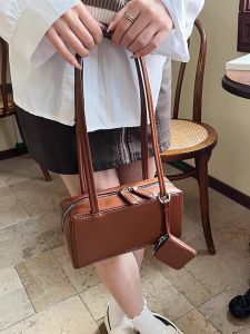 กระเป๋าถือผู้หญิงสีดำ กระเป๋าสะพายข้างใต้วงแขน กระเป๋าแฟชั่นฤดูใบไม้ผลิ 2025 วัสดุ PU กระเป๋าสะพายข้างแบบลำลอง