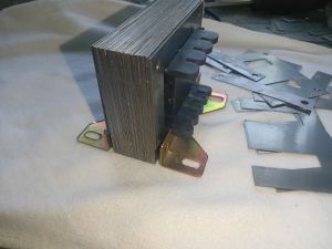 3AMPERE TRANSFORMER EI CORE WITH BOBBINS AND FOOTING BRACKET.