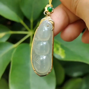 High Quality Good Translucent Light Green Hue Natural Type A Jadeite Jade Crafted as Bean set on 18k gold as Pendant Necklace certificate weighs 6.88 grams (18kp68)