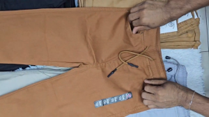 Gray drawstring pants for children size range 6m - 60m. Four pairs in different sizes. Casual style with pockets and adjustable waist. Suitable for everyday wear.