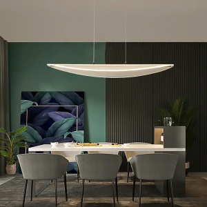 Modern bedroom with beige bed and curtains featuring a sleek curved pendant light hanging from the ceiling.