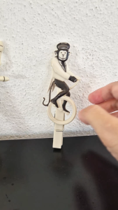 Pegzini Family circus-themed vintage laundry peg (monkey riding a unicycle)