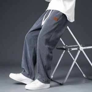 กางเกงขายาวลำลองผู้ชาย ผ้าฟลีซหนานุ่ม อุ่นสบาย ผ้าลูกฟูก มีเชือกผูก เอวสม็อค ทรงตรง เหมาะสำหรับฤดูใบไม้ร่วงและฤดูหนาว สไตล์สตรีทแวร์ลำลอง