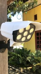 LAMPU TENAGA SURYA MATAHARI / SOLAR CTB / TENAGA MATAHARI MODEL CCTV/ KAMERA CAMERA PALSU/LAMPU TAMAN TEMBOK DINDING PAKAI REMOT Sensor Solar Tenaga Matahari Surya Outdoor 77 LED