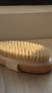 SPA Brush Bathing Brush: A Soft Body Scrubbing Tool for Deep Skin Cleansing\\n\\n What is a SPA Bathing Brush?\\n\\nA SPA bathing brush, also known as a soft body scrubbing tool, is a natural bristle brush designed to exfoliate and cleanse the skin. This brush is equipped with a flax strap grip that offers a comfortable and secure hold during use. It is perfect for those looking to achieve deep skin cleansing and a smoother complexion.\\n\\n Key Features\\n\\n- Natural bristle brush: The brush features soft, natural bristles that gently exfoliate the skin, removing dead cells and impurities.\\n\\n- Flax strap grip: The flax strap grip provides a comfortable and secure hold, making it easy to maneuver the brush during use.\\n\\n- Deep skin cleansing: The SPA bathing brush effectively cleanses the skin, leaving it feeling refreshed and rejuvenated.\\n\\n Benefits of Using a SPA Bathing Brush\\n\\nUsing a SPA bathing brush offers numerous benefits for your skin:\\n\\n- Improved circulation: The gentle exfoliation process increases blood flow to the skin, promoting healthy cell growth and a radiant complexion.\\n\\n- Removal of dead skin cells: The natural bristles effectively remove dead skin cells, revealing smoother and healthier-looking skin.\\n\\n- Enhanced product absorption: By removing dead skin cells, the brush helps your skincare products penetrate deeper into the skin, maximizing their effectiveness.\\n\\n- Reduced appearance of cellulite: Regular use of the SPA bathing brush can help reduce the appearance of cellulite by promoting lymphatic drainage and improving skin elasticity.\\n\\n How to Choose the Right SPA Bathing Brush\\n\\nWhen selecting a SPA bathing brush, consider the following factors:\\n\\n Material Considerations\\n\\n- Natural bristles: Look for brushes made from natural materials like plant fibers or boar bristles, which are gentle on the skin and provide effective exfoliation.\\n\\n- Flax strap grip: Opt for brushes with a flax strap grip for a secure and comfortable hold during use.\\n\\n Grip & Handle Design\\n\\n- Ergonomic handle: Choose a brush with an ergonomic handle that fits comfortably in your hand, allowing for easy maneuverability during use.\\n\\n- Non-slip grip: Look for brushes with a non-slip grip to prevent slipping and ensure a secure hold while using the brush.\\n\\n How to Use a SPA Bathing Brush for Deep Skin Cleansing\\n\\nTo achieve deep skin cleansing with your SPA bathing brush, follow these steps:\\n\\n Preparing Your Skin\\n\\n- Wet your skin: Before using the brush, wet your skin with warm water to help soften the skin and open up pores.\\n\\n- Apply a gentle cleanser: Apply a mild cleanser to your skin to help lift dirt and impurities.\\n\\n Proper Brushing Technique\\n\\n- Start at the feet: Begin brushing at your feet and work your way up towards your heart. This helps promote lymphatic drainage and improves circulation.\\n\\n- Use gentle circular motions: Gently brush your skin using circular motions, applying light pressure to avoid irritating the skin.\\n\\n- Focus on problem areas: Pay special attention to areas with rough or dry skin, such as elbows, knees, and heels.\\n\\n Maintaining Your SPA Bathing Brush\\n\\nTo keep your SPA bathing brush in good condition, follow these tips:\\n\\n Cleaning & Storage Tips\\n\\n- Rinse after use: After each use, rinse the brush thoroughly with warm water to remove any dirt or residue.\\n\\n- Allow to air dry: Place the brush in a well-ventilated area to air dry completely before storing.\\n\\n- Store upright: Store the brush upright to prevent water from pooling at the base and causing damage.\\n\\n Extending the Life of Your Brush\\n\\n- Replace bristles as needed: Over time, the bristles may become worn or damaged. Replace them as needed to maintain the effectiveness of the brush.\\n\\n- Avoid harsh chemicals: Refrain from using harsh chemicals or abrasive cleaners on the brush, as they can damage the bristles and grip.\\n\\nBy following these guidelines, you can enjoy the benefits of deep skin cleansing with your SPA bathing brush while extending its lifespan.\n}