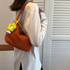 TAS BAHU NYLON / TAS BAHU WANITA SIMPLE ALA KOREA / TAS BAHU MINI / MINI SHOULDER BAG / NYLON SHOULDER BAG\\n\\n Apa itu Tas Bahu Nyaman?\\n\\nTas bahu nyaman adalah tas yang dirancang untuk memudahkan penggunanya dalam membawa barang-barang penting mereka. Tas ini biasanya memiliki desain ergonomis dan bahan yang ringan, sehingga tidak membuat penggunanya merasa lelah ketika membawanya.\\n\\n Bagaimana Menentukan Ukuran Tas Bahu yang Ideal\\n\\nUntuk menentukan ukuran tas bahu yang ideal, pertimbangkan faktor-faktor berikut:\\n\\n- **Fungsi:** Apakah tas tersebut akan digunakan untuk bekerja, sekolah, atau hobi lainnya? Ukuran tas yang ideal bisa berbeda-beda tergantung pada aktivitas yang akan dilakukan.\\n\\n- **Kebutuhan:** Seberapa banyak barang-barang yang akan dibawa? Pertimbangkan ukuran tas yang cukup untuk menampung semua barang yang diperlukan.\\n\\n- **Gaya:** Tas bahu yang nyaman juga harus sesuai dengan gaya dan preferensi penggunanya. Pilihlah tas dengan desain yang sesuai dengan penampilan dan selera Anda.\\n\\n Manfaat Tas Bahu Nyaman bagi Wanita\\n\\nBeberapa manfaat menggunakan tas bahu nyaman bagi wanita antara lain:\\n\\n- **Praktis:** Tas bahu nyaman memudahkan wanita untuk membawa barang-barang penting mereka tanpa perlu khawatir akan lelah atau sakit bahu.\\n\\n- **Stylish:** Dengan berbagai pilihan desain dan warna, tas bahu nyaman juga bisa menjadi aksesori penunjang penampilan wanita.\\n\\n- **Multifungsi:** Tas bahu nyaman bisa digunakan untuk berbagai aktivitas, seperti bekerja, sekolah, jalan-jalan, dan lain-lain.\\n\\n Tas Bahu Ala Korea: Keunikan & Trend\\n\\nTas bahu ala Korea memiliki keunikan dan trend yang berbeda-beda, mulai dari desain simpel hingga warna-warna cerah yang menarik. Tas bahu ala Korea juga sering dikombinasikan dengan pakaian casual, membuat penampilan menjadi lebih modis.\\n\\n Cara Memilih Tas Bahu Ala Korea yang Sesuai\\n\\nUntuk memilih tas bahu ala Korea yang sesuai, pertimbangkan faktor-faktor berikut:\\n\\n- **Warna:** Pilihlah warna yang sesuai dengan penampilan dan selera Anda. Warna-warna cerah biasanya cocok untuk penampilan yang lebih modis.\\n\\n- **Desain:** Pilihlah desain yang sesuai dengan gaya dan preferensi Anda. Tas bahu ala Korea biasanya memiliki desain simpel dan elegan.\\n\\n- **Kualitas:** Pastikan tas bahu ala Korea yang dipilih memiliki kualitas yang baik, agar awet dan tetap cantik dalam jangka waktu yang lama.\\n\\n Tips Mengombinasikan Tas Bahu Ala Korea dengan Pakaian\\n\\nBerikut beberapa tips mengombinasikan tas bahu ala Korea dengan pakaian:\\n\\n- **Pilihlah warna tas yang sesuai dengan warna pakaian:** Tas bahu ala Korea biasanya memiliki warna-warna cerah, jadi pastikan warna tas sesuai dengan warna pakaian yang dikenakan.\\n\\n- **Kombinasikan dengan pakaian casual:** Tas bahu ala Korea biasanya cocok dikombinasikan dengan pakaian casual, seperti kaos, celana jeans, dan sepatu sneakers.\\n\\n- **Tambahkan aksesori penunjang:** Tambahkan aksesori penunjang, seperti anting atau gelang, untuk menambah nilai estetika penampilan Anda.\\n\\n Tas Bahu untuk Perempuan: Fungsi & Kelebihan\\n\\nTas bahu untuk perempuan memiliki fungsi dan kelebihan yang berbeda-beda, tergantung pada desain dan bahan yang digunakan. Beberapa fungsi dan kelebihan tas bahu untuk perempuan antara lain:\\n\\n- **Praktis:** Tas bahu untuk perempuan memudahkan dalam membawa barang-barang penting mereka.\\n\\n- **Stylish:** Tas bahu untuk perempuan juga bisa menjadi aksesori penunjang penampilan wanita.\\n\\n- **Multifungsi:** Tas bahu untuk perempuan bisa digunakan untuk berbagai aktivitas, seperti bekerja, sekolah, jalan-jalan, dan lain-lain.\\n\\n Bagaimana Memilih Tas Bahu yang Sesuai dengan Aktivitas\\n\\nUntuk memilih tas bahu yang sesuai dengan aktivitas, pertimbangkan faktor-faktor berikut:\\n\\n- **Fungsi:** Apakah tas tersebut akan digunakan untuk bekerja, sekolah, atau hobi lainnya? Ukuran tas yang ideal bisa berbeda-beda tergantung pada aktivitas yang akan dilakukan.\\n\\n- **Kebutuhan:** Seberapa banyak barang-barang yang akan dibawa? Pertimbangkan ukuran tas yang cukup untuk menampung semua barang yang diperlukan.\\n\\n- **Gaya:** Tas bahu yang nyaman juga harus sesuai dengan gaya dan preferensi penggunanya. Pilihlah tas dengan desain yang sesuai dengan penampilan dan selera Anda.\\n\\n Tips Merawat Tas Bahu Agar Awet & Tetap Cantik\\n\\nBerikut beberapa tips merawat tas bahu agar awet dan tetap cantik:\\n\\n- **Jangan memasukkan barang-barang yang berat:** Tas bahu yang dipenuhi dengan barang-barang berat bisa membuat tas menjadi rusak atau aus.\\n\\n- **Simpan di tempat yang aman:** Simpan tas bahu di tempat yang aman dan tidak lembab, agar tas tidak mudah rusak atau berjamur.\\n\\n- **Bersihkan secara rutin:** Bersihkan tas bahu secara rutin, agar tas tetap bersih dan cantik.\\n\\n Tas Bahu Wanita Simple: Keindahan Simplicity\\n\\nTas bahu wanita simple memiliki keindahan simplicitas yang menarik, dengan desain sederhana namun elegan. Tas bahu wanita simple juga bisa dikombinasikan dengan berbagai pakaian, sehingga penampilan menjadi lebih modis.\\n\\n Cara Memilih Tas Bahu Simple yang Sesuai dengan Gaya Anda\\n\\nUntuk memilih tas bahu simple yang sesuai dengan gaya Anda, pertimbangkan faktor-faktor berikut:\\n\\n- **Warna:** Pilihlah warna tas yang sesuai dengan penampilan dan selera Anda. Warna-warna netral biasanya cocok untuk penampilan yang lebih simple.\\n\\n- **Desain:** Pilihlah desain yang sederhana namun elegan, agar sesuai dengan gaya Anda.\\n\\n- **Kualitas:** Pastikan tas bahu simple yang dipilih memiliki kualitas yang baik, agar awet dan tetap cantik dalam jangka waktu yang lama.\\n\\n Tips Mengombinasikan Tas Bahu Simple dengan Pakaian\\n\\nBerikut beberapa tips mengombinasikan tas bahu simple dengan pakaian:\\n\\n- **Pilihlah warna tas yang sesuai dengan warna pakaian:** Tas bahu simple biasanya memiliki warna-warna netral, jadi pastikan warna tas sesuai dengan warna pakaian yang dikenakan.\\n\\n- **Kombinasikan dengan pakaian casual atau formal:** Tas bahu simple biasanya cocok dikombinasikan dengan pakaian casual maupun formal, tergantung pada kebutuhan dan situasi.\\n\\n- **Tambahkan aksesori penunjang:** Tambahkan aksesori penunjang, seperti anting atau gelang, untuk menambah nilai estetika penampilan Anda.\\n\\n Tas Bahu Mini Nilon: Kelebihan & Kekurangan\\n\\nTas bahu mini nilon memiliki kelebihan dan kekurangan yang berbeda-beda, tergantung pada desain dan bahan yang digunakan. Beberapa kelebihan dan kekurangan tas bahu mini nilon antara lain:\\n\\n- **Kelebihan:** Tas bahu mini nilon biasanya ringan dan mudah dibawa, sehingga cocok untuk aktivitas sehari-hari.\\n\\n- **Kekurangan:** Tas bahu mini nilon biasanya memiliki kapasitas yang terbatas, sehingga tidak cocok untuk membawa barang-barang berat atau banyak.\\n\\n Bagaimana Memilih Tas Bahu Mini Nilon yang Berkualitas\\n\\nUntuk memilih tas bahu mini nilon yang berkualitas, pertimbangkan faktor-faktor berikut:\\n\\n- **Bahan:** Pilihlah bahan yang berk