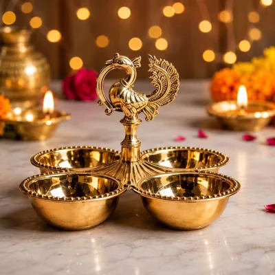 Peacock holder with traditional items Haldi Kumkum Chandan Akshata on decorated tray for festival or guest welcome.