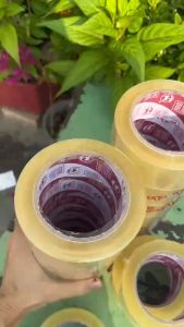 Băng keo dán thùng 100 ya loại dày (1 cây 6 cuộn 1.2 kg) dán chắc dính tốt màng keo chắc chắn - Rubik 77