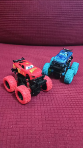Four wheel drive off-road vehicle toy with durable plastic body and spring suspension for active kids.