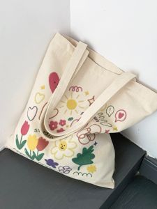 ใหม่แฟชั่นดอกไม้พิมพ์ผ้าแคนวาสกระเป๋าเนื้อนุ่มหวานสไตล์เกาหลีกระเป๋าสะพายสําหรับนักเรียนและผู้สัญจร