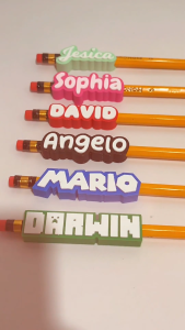 Personalized Pencil Topper with Name Sleeves for Customization. Features: Soft & Durable Plastic Personalized Names Bright Colors Adjustable Fit Fun Designs. Suitable for School or Office Use.