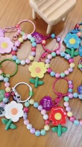 Sunshine ลูกปัดดอกไม้พวงกุญแจสี Candy กระเป๋ารถพวงกุญแจเรซิ่นจี้วงกลมแขวนเครื่องประดับแฟชั่นเครื่องประดับอุปกรณ์เสริม403