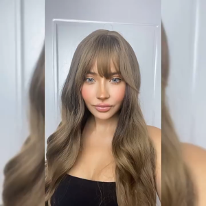 Long Wavy Blonde Wig with Bangs Heat Resistant Synthetic Hair Natural Looking and Soft Touch Perfect for Daily Wear Cosplay Party or Fashion Styling Easy to Wear and Maintain Comfortable Cap for All Day Use