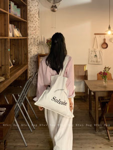 กระเป๋าผ้าใบลายตัวอักษรความจุขนาดใหญ่ สไตล์เกาหลี กระเป๋าสะพายไหล่ข้างเดียวแบบลำลอง สีขาว กระเป๋าผ้าใบสำหรับผู้หญิง กระเป๋าถือแบบลำลอง