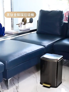 A must-have trash can in the living room with a foot-operated lid opening mechanism and ample stora