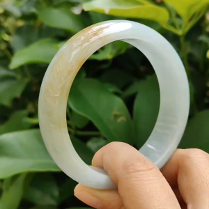 Beautiful Crafted as 59mm Peace Bangle with Light Green Hue Brownish Yellow Type-A Natural Jadeite-Jade certificate weighs 77.9 grams Width: 17.6 * Thickness 8 mm (bangle12)