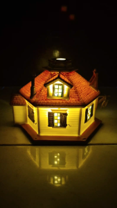 Ceramic glowing miniature house with battery