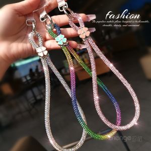 สร้อยข้อมือโทรศัพท์มือถือดีไซน์เรียบง่ายหรูหรา ชุบทอง คริสตัล โลหะผสม ลาย 4 ใบ พร้อมกุญแจ ชุบทอง เครื่องประดับแฟชั่นสำหรับผู้หญิง