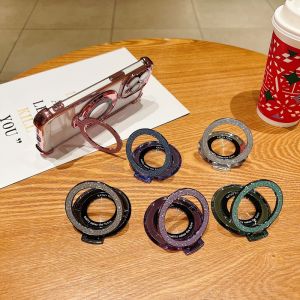 CrashStar เคสโทรศัพท์มีกาวแวววาวอเนกประสงค์พับเก็บได้แม่เหล็กที่มองไม่เห็นสำหรับหมอน iPhone, Huawei, Xiaomi, Redmi, Infinix โดยจับเดสก์ท็อปอูปกรณ์เสริมของชาร์จไร้สาย