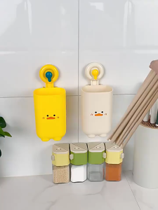 Wall-mounted Chopstick Storage Box with Drainage Holes for Quick Drying. Keeps Utensils Dry and Prevents Mold. Features Duck Face Design and Suction Cup for Mounting.