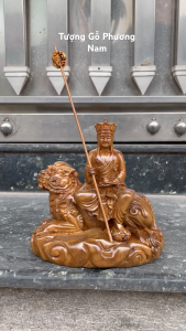 Tượng phật địa tạng cưỡi linh thú cao 15cm chất liệu gỗ bách xanh nguyên khối