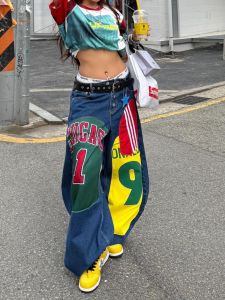 กางเกงยีนส์ทรงหลวมขากว้างพิมพ์ลายสไตล์อเมริกันสำหรับผู้หญิง กางเกงขายาวทรงหลวมๆ สไตล์ย้อนยุค กางเกงยีนส์ทรงสตรีทสำหรับฤดูใบไม้ร่วง