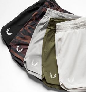 Mens Fitness Short Pants Quick Dry Breathable Elastic Fourths Deep Squat Training Shorts Muscle Boy Brand Summer Sportswear