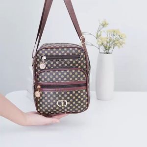 VIVIBAGS#351 Functional square sling crossbody bag featuring multiple zippered compartments and a distinctive geometric monogram pattern.