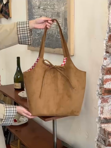 SEA YADOU  กระเป๋าโท้ทสะพายไหล่ผู้หญิงแฟชั่นสีปิดกั้นสองด้านผูกโบว์กระเป๋าพร็อพความจุขนาดใหญ่