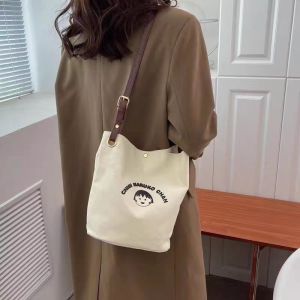 Adorable Snoopy Canvas Bucket Bag Single Shoulder Commuter Womens Bag Fashionable Versatile Crossbody Small Bag for Daily Use