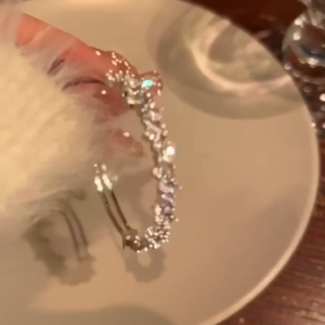 A high-end exquisite 925 silver bracelet with diamond-set zirconia featuring an open design resembling a starry sky - luxurious and glittering with a sense of broken irregularity.
