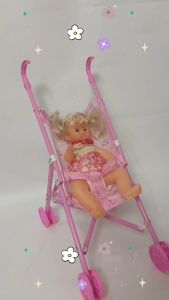 SSP Girl sitting in a baby stroller will blink doll for kids