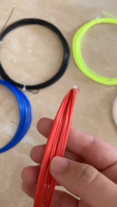 Senar Raket Badminton / Bulu Tangkis Merk Whizz Diameter / Tebal 0.7mm