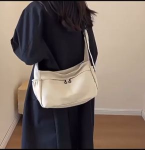 Multi compartment canvas crossbody bag