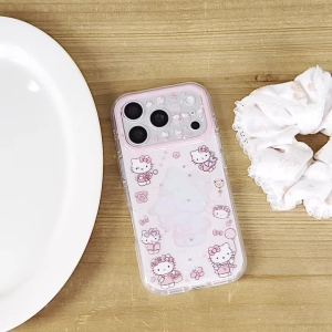 Sanrio | Sweet Pink Hollow-Out Sanrio Hello Kitty Shockproof Phone Case For iphone 17 16 15 Pro Max 17 Pro Lens Camera Protective Cover
