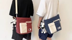 กระเป๋าสบาย ๆ ข้ามพรมแดนสำหรับผู้หญิง ins ความจุขนาดใหญ่นักเรียนผ้าใบกระเป๋าสะพายเกาหลีกระเป๋าสะพายไหล่กระเป๋าสะพายสีสันเรียบง่าย