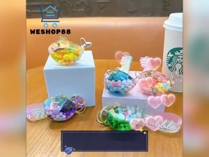 WESHOP88 1pcs Creative Glitter into Oil Floating Jelly Bean Keychain Acrylic Whale Liquid Keychain Car Key Pendant