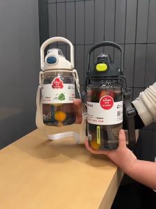 Cille tritan material water bottle. Good appearance and large capacity. Dual suction methods with strap easy to carry