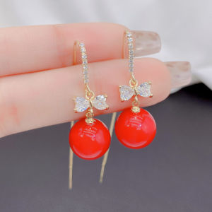 ต่างหูไข่มุกสีแดงปีใหม่ ดีไซน์ผูกโบว์ผีเสื้อ ต่างหูสไตล์ย้อนยุค เครื่องประดับหูระดับไฮเอนด์ เครื่องประดับแฟชั่น