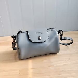 High-grade portable cylinder leather soft surface simple shoulder bag all crossbody pen holder bag niche design pillow bag