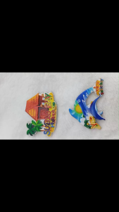 Subic Bay Philippines souvenir magnet with house and palm trees and dolphin magnet with beach scene.