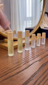 10ml Cosmetics frosted clear roller Glass bottle with wood printed plastic cap