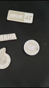 EMBLEM MOTOR YAMAHA GARPUTALA OK GARANSI YAMALUBE AT STAINLESS