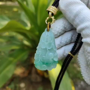 Premium quality White with green patches Ruyi Cabbage Natural Type A Jadeite Pendant with NGI Gemstone report weight 124.96 grams 49.88 * 27.31 * 15.96 mm  Translucent fine grain crystal aggregate (pendant134)